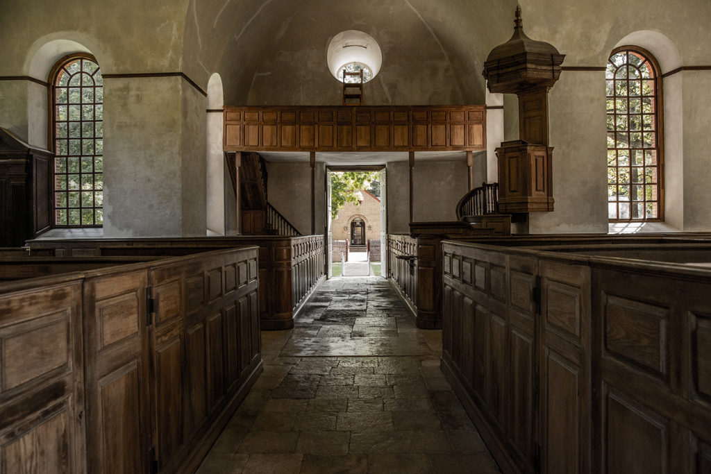 Historic Christ Church of 1732 building interior with pews and lectern | Photo by Nicholas Crawford